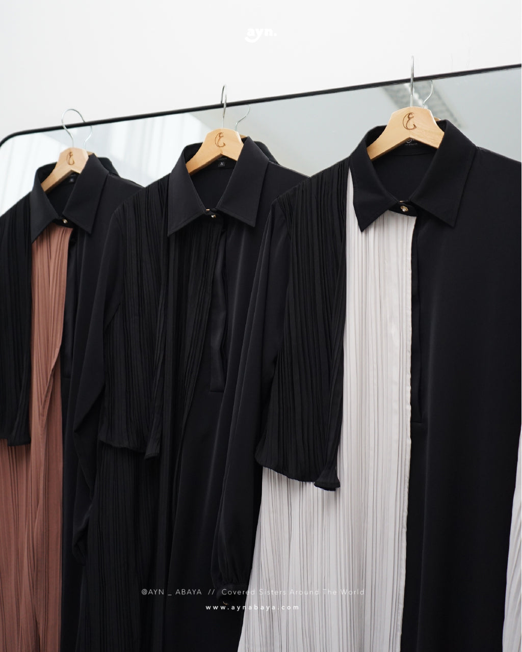 AYN PLISSE ASYMETRICAL LONG SHIRT
